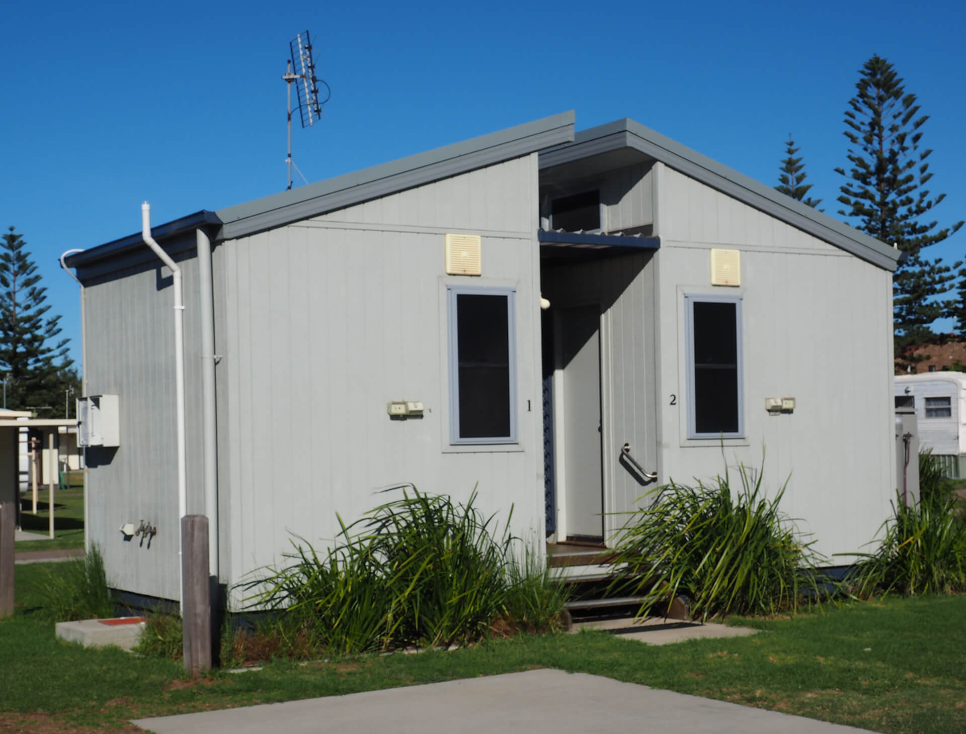 An Ensuite building that contains two separate bathrooms and toilets